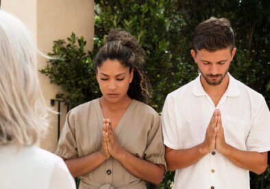 front-view-people-praying-together